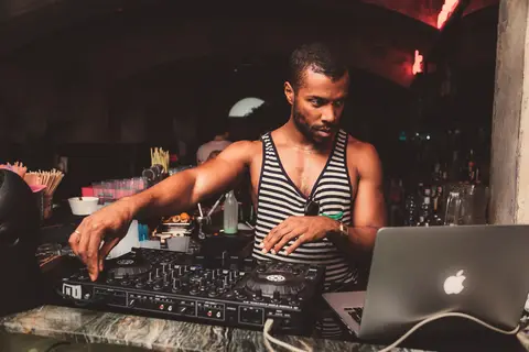 DJ at the marble bar at Thell